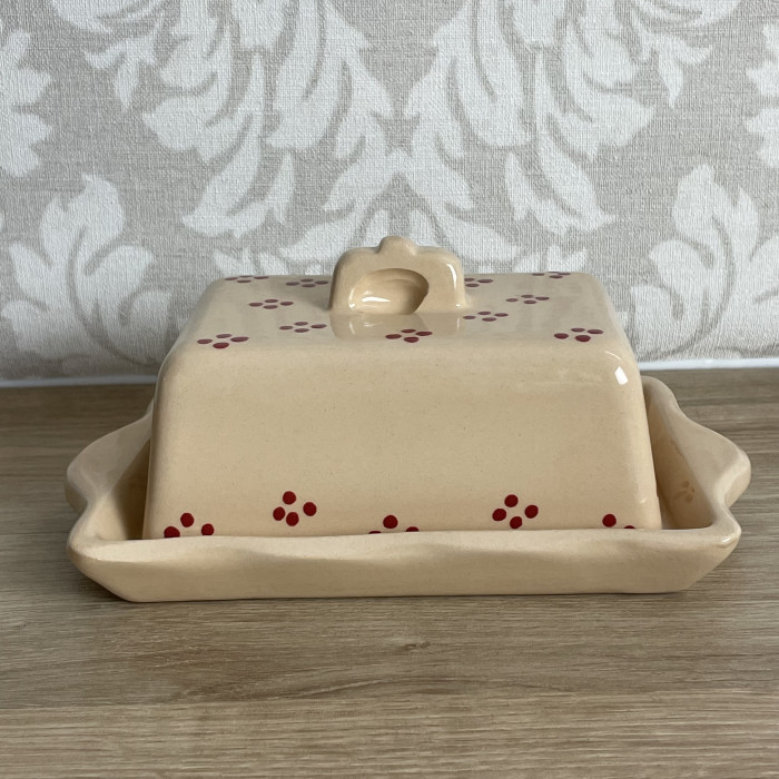 Butter dish cream with red points